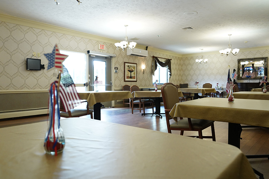 Table with flag vase in Dining Room- Arbors at Delaware